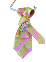 Load image into Gallery viewer, Pink and Green patterned necktie with a pearl necklace
