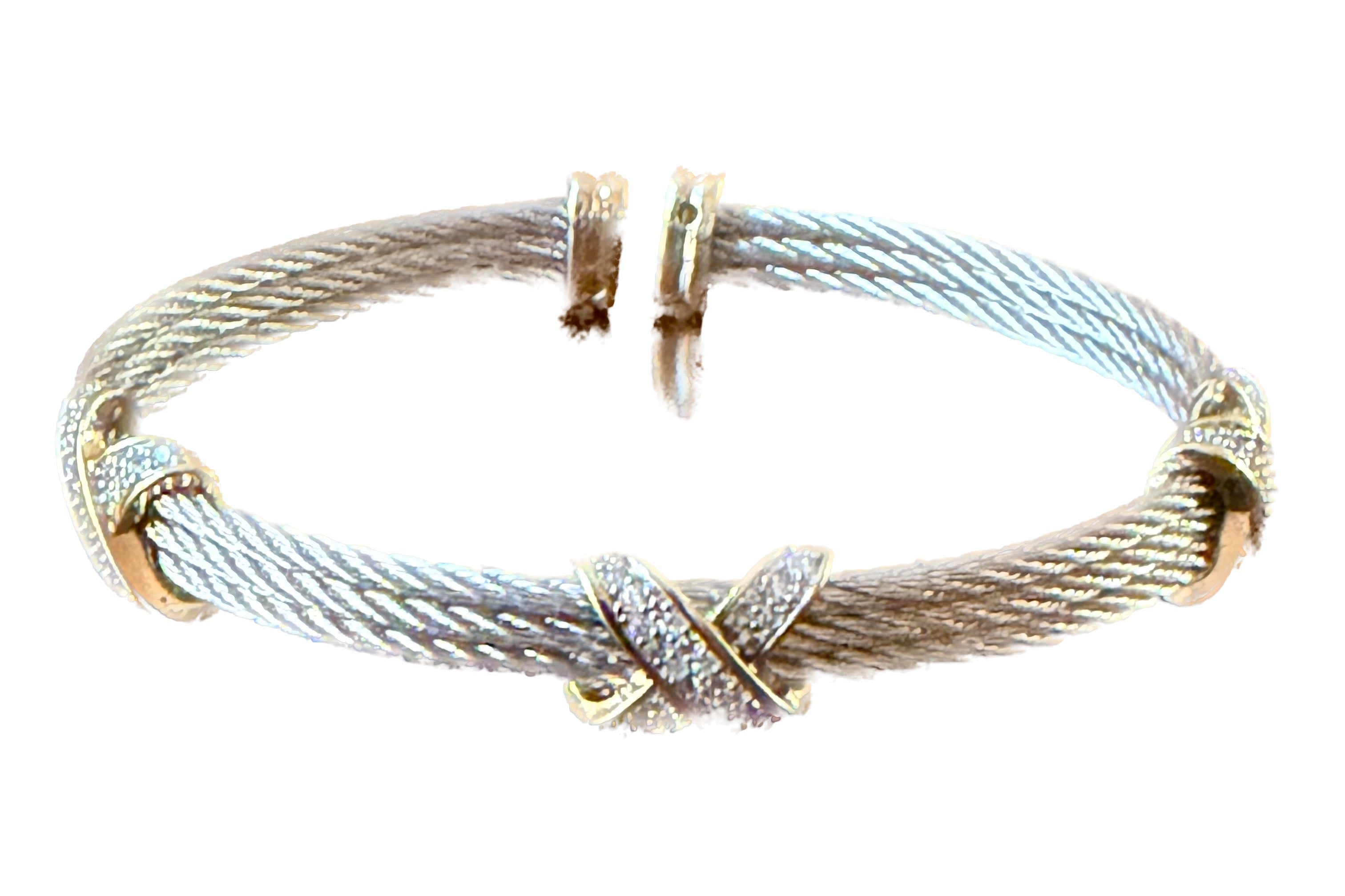 Bracelet with gold and silver cable design on a white background
