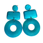 Load image into Gallery viewer, A pair of turquoise blue geometric dangle earrings with a small oval, rectangular, and concentric circle design, displayed on a white background.
