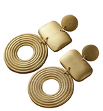 Load image into Gallery viewer, Pair of gold wooden geometric earrings on a white surface 
