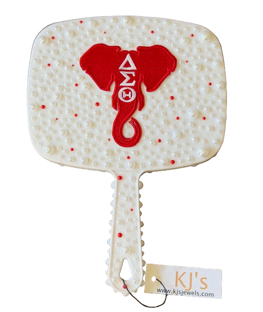 Decorative mirror with red elephant design and 'KJ's' branding 