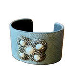 Load image into Gallery viewer, Gray snakeskin textured cuff bracelet with decorative pearl elements 
