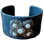 Load image into Gallery viewer, Black snakeskin textured cuff bracelet with druzy/pearl decorative elements
