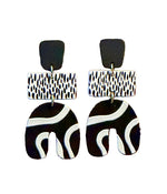 Load image into Gallery viewer, Pair of black and white patterned earrings 
