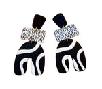 Load image into Gallery viewer, Black and white patterned earrings on a white surface
