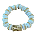 Load image into Gallery viewer, Beaded bracelet with gold accents with a white background
