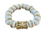 Load image into Gallery viewer, Bracelet with white and gold beads with a white background
