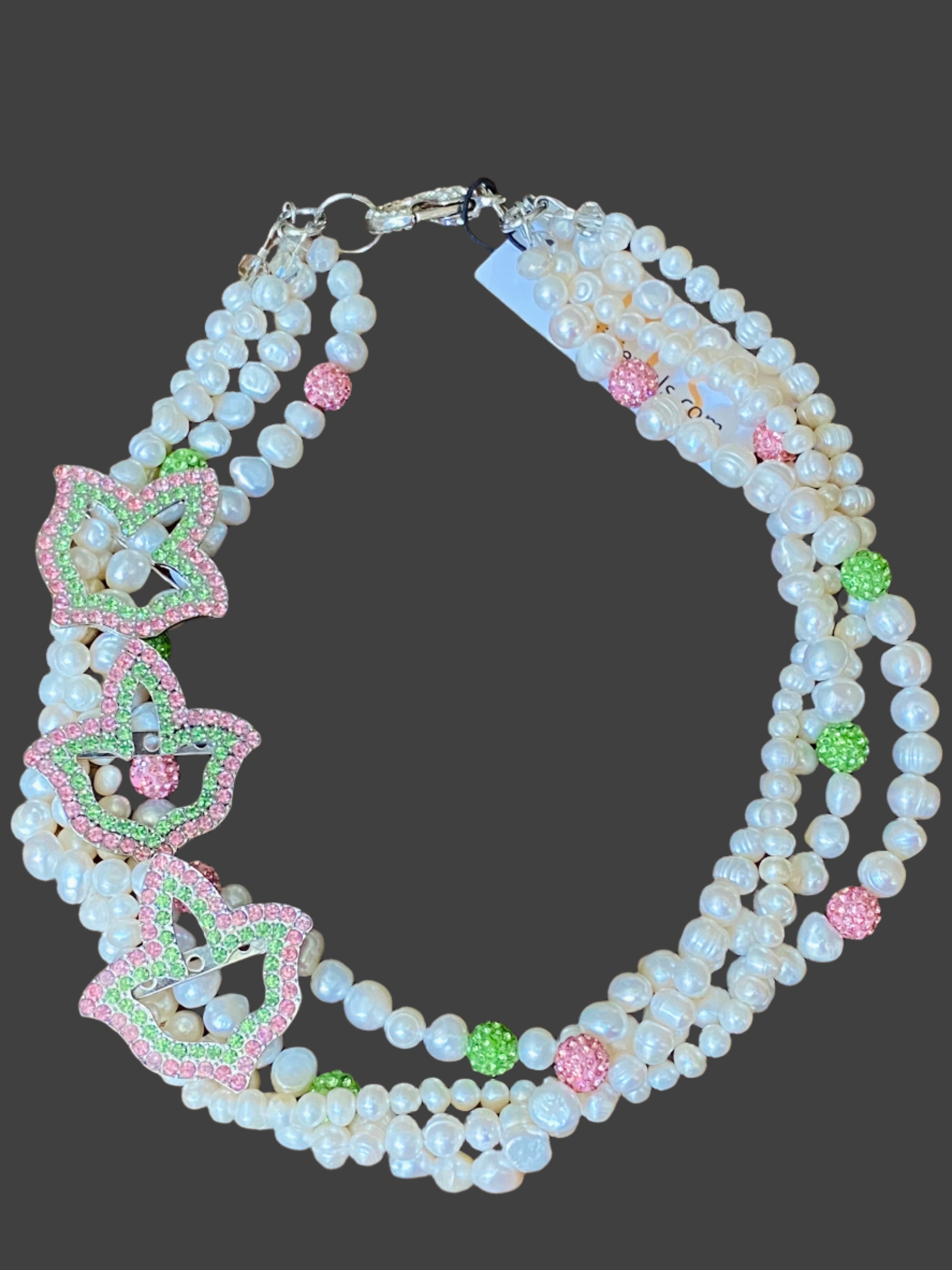 pearl necklace with 3 pink and green ivy brooches