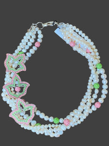 pearl necklace with 3 pink and green ivy brooches