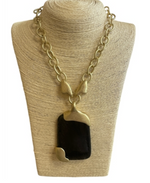 Load image into Gallery viewer, Gold Tone Statement Necklace with Black Resin Pendant

