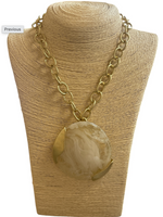 Load image into Gallery viewer, Gold Tone Statement Necklace with Round Resin Pendant

