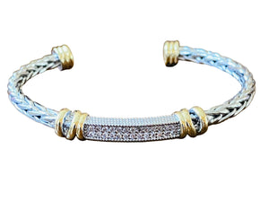 Two-Toned braided bracelet with gold accents on a white background